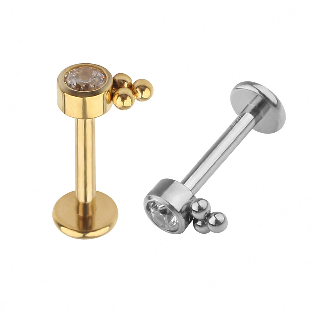 Manek° labret de titanio de grado implante ASTM F136 con rosca interna, engaste de circonita transparente y soldadura de perlas.