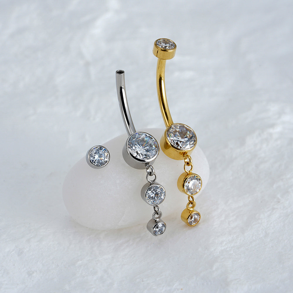 Manek° Piercing para ombligo  ASTM F136 de titanio con colgante de circonita en bisel cúbica 14G.