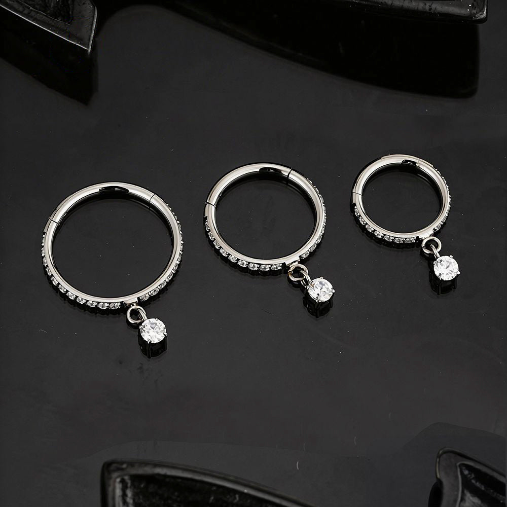 Manek° Anillo de aro con cierre de clic, colgante, articulado, de titanio ASTM F136 con circonitas cúbicas, ideal para piercing daith, septum o nariz 16G.