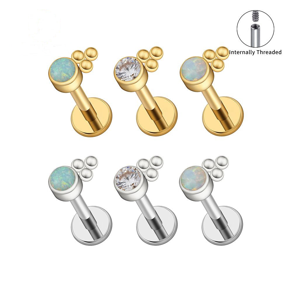 Manek° labret de titanio de grado implante ASTM F136 con rosca interna, engaste de circonita transparente y soldadura de perlas.